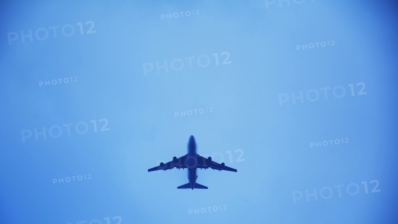Airplane flying against clear sky