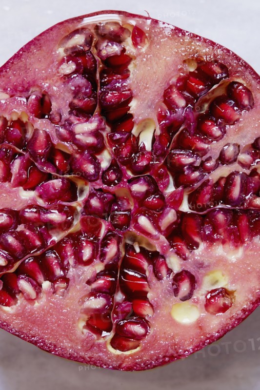 Halved Pomegranate against white background