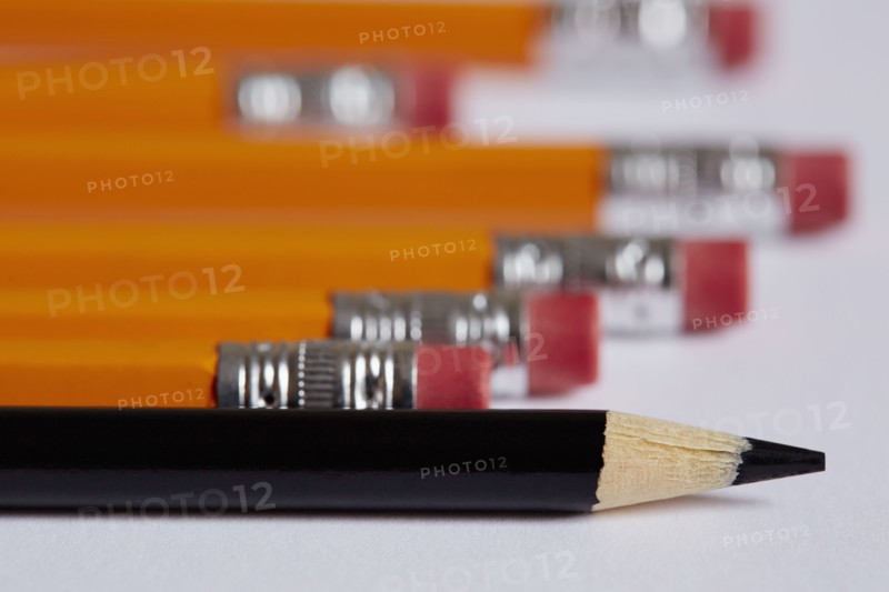 Pencils and crayon on white surface