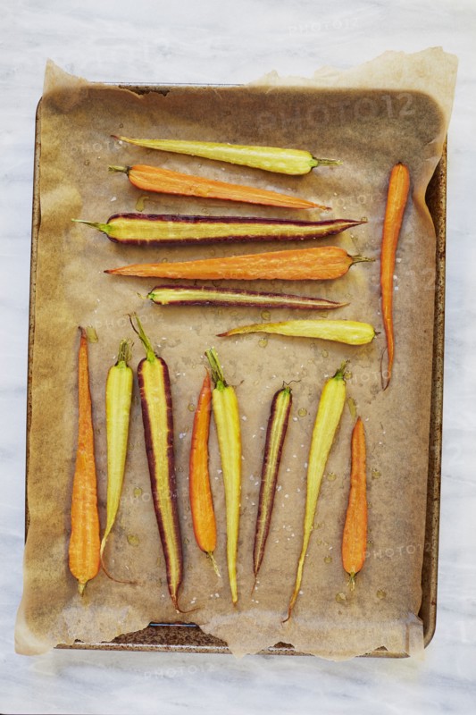 Sliced carrots on baking sheet