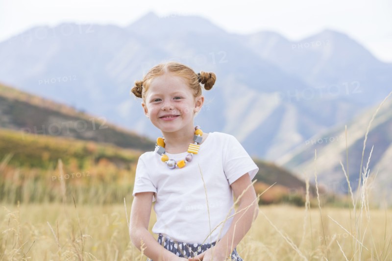 USA, Utah, Provo, Girl (4-5) standing in field