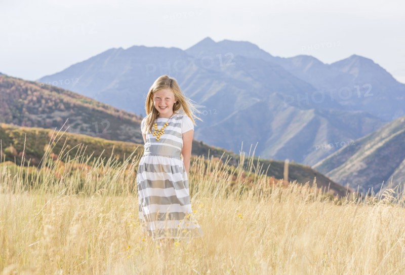 USA, Utah, Provo, Girl (8-9) standing in field