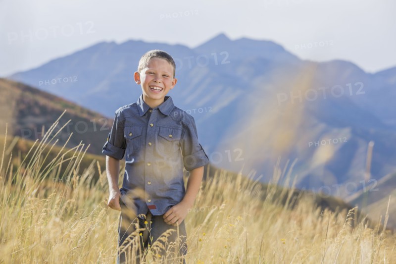 USA, Utah, Provo, Boy (6-7) standing in field