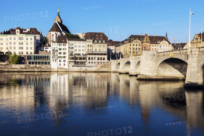 Switzerland, Basel, Basel-Stadt, Houses by Rhine River and stone bridge