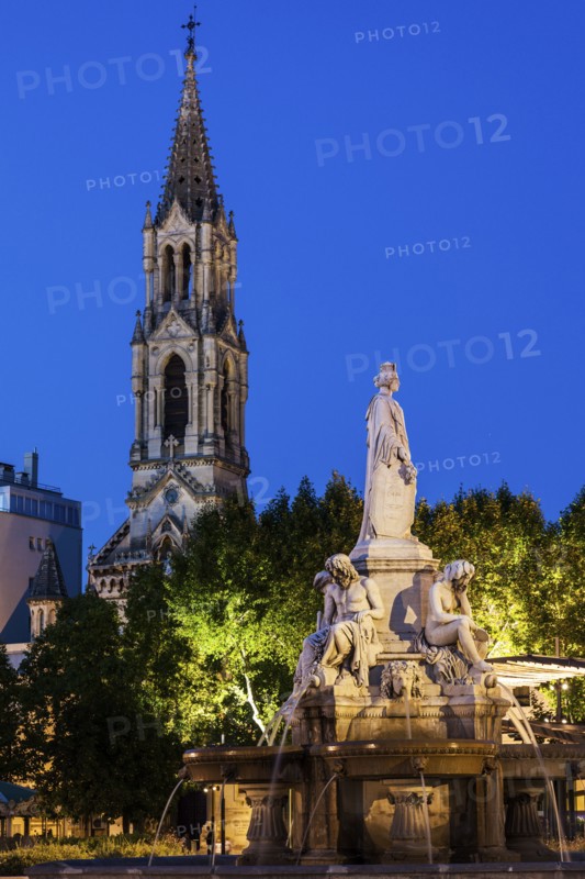 France, Occitanie, Nimes, Esplanade Charles De Gaulle with fountain at dusk