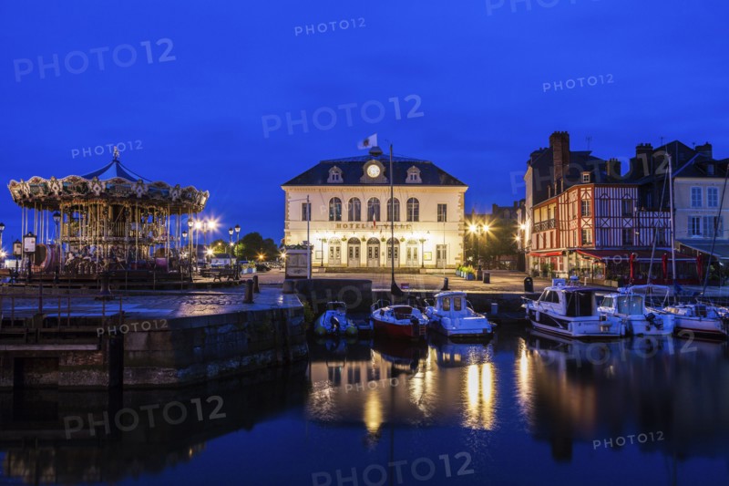France, Normandy, Honfleur, Town hall with port at dusk