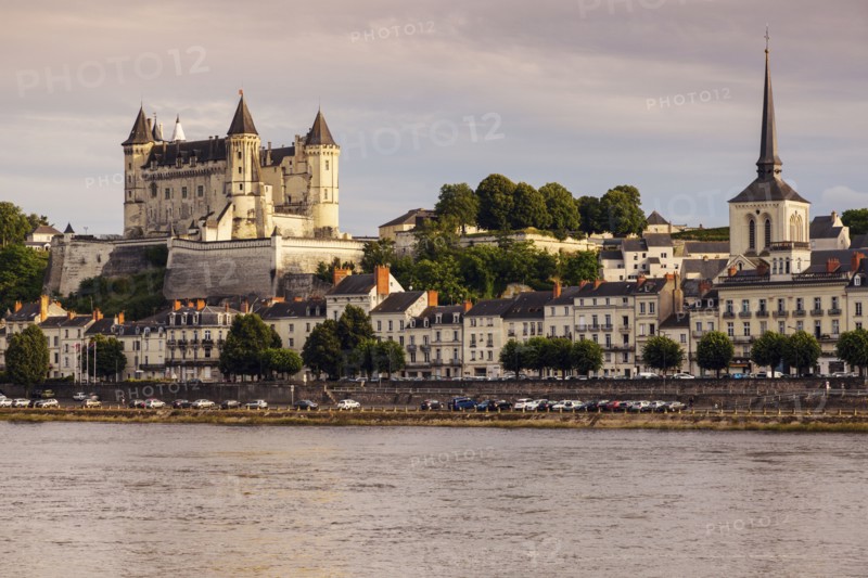 France, Pays de la Loire, Saumur, City waterfront at sunset