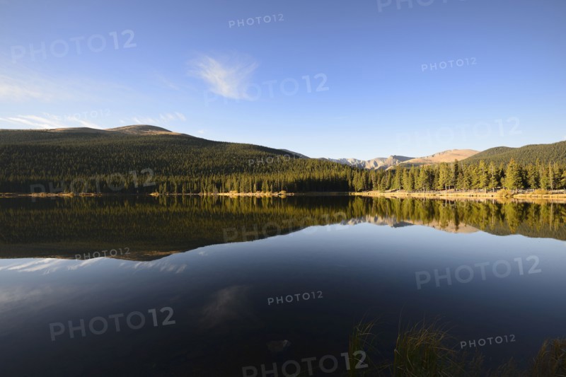USA, Colorado, Mount Evans and forest reflecting in Echo Lake