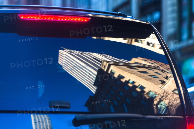 USA, New York State, New York City, Buildings reflecting in windows of suv