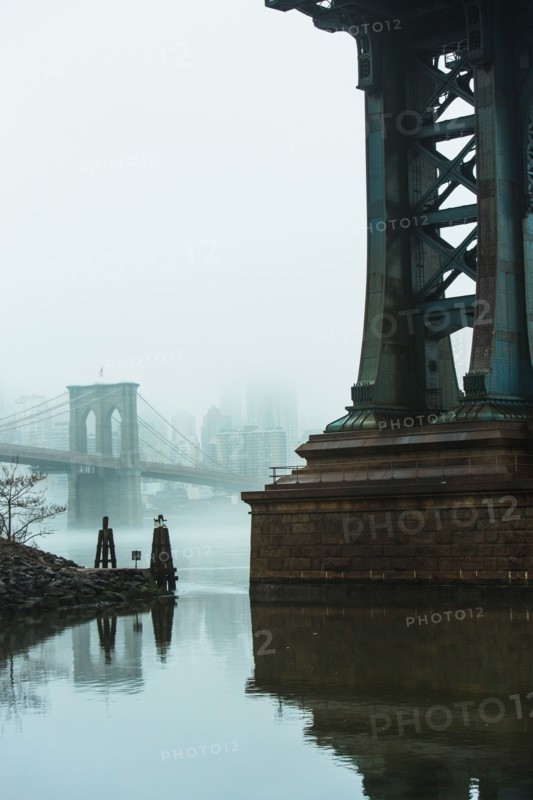 USA, New York, New York City, Manhattan, Brooklyn Bridge over East River in fog