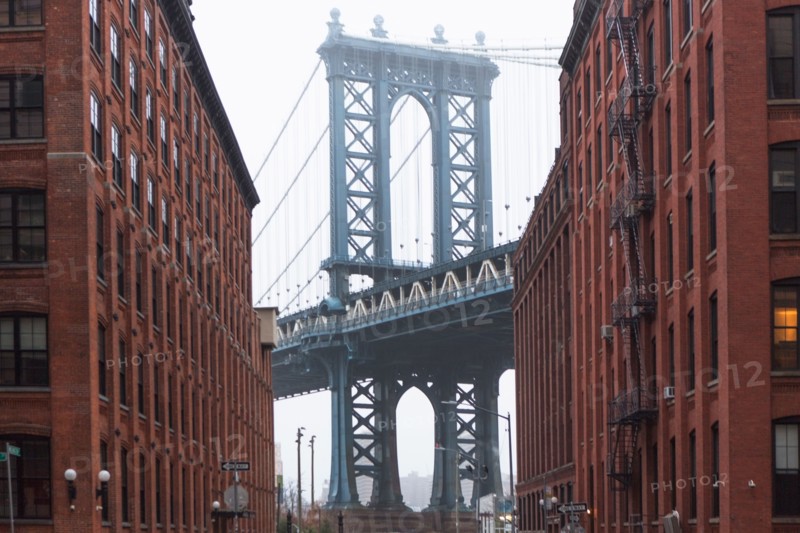 USA, New York, New York City, Manhattan, Brooklyn Bridge between buildings