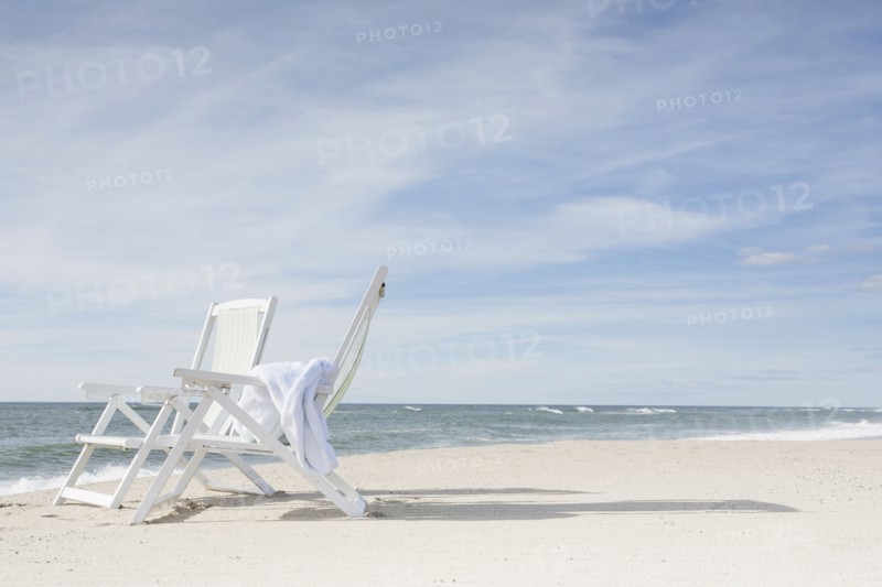 Chairs on beach after sunrise