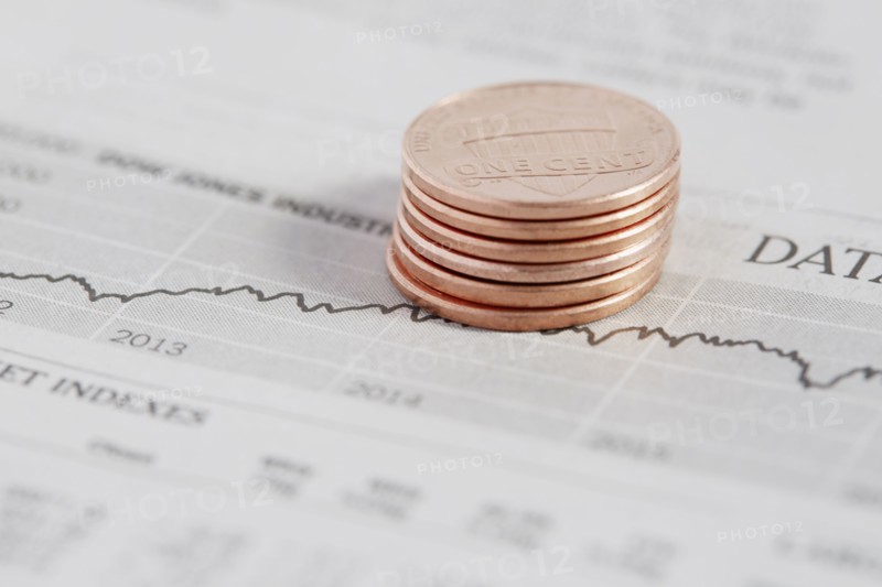 Stack of coins on stock market data
