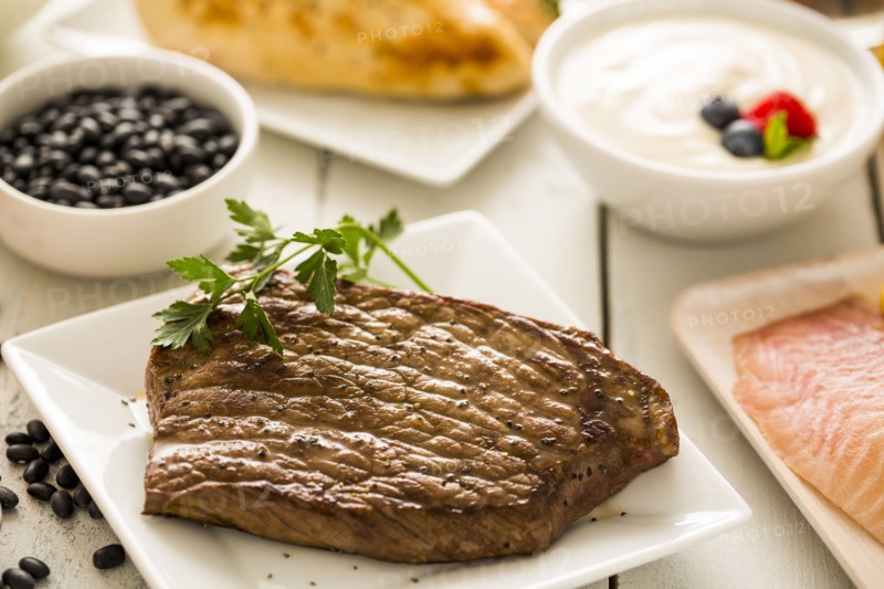 Grilled chicken served with black beans, yogurt and cottage cheese