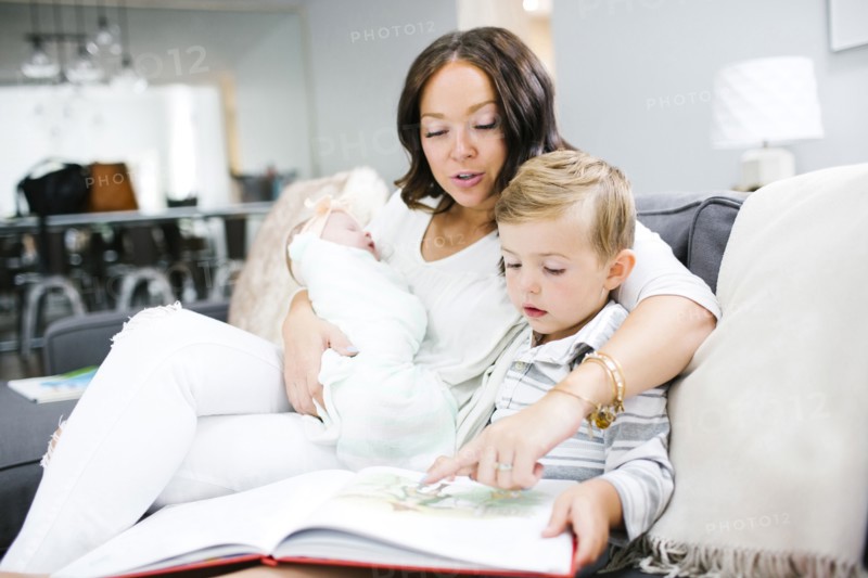Woman spending time with children (0-1 months, 4-5)