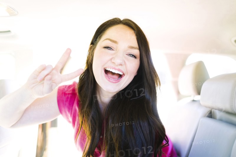 Woman making peace gesture