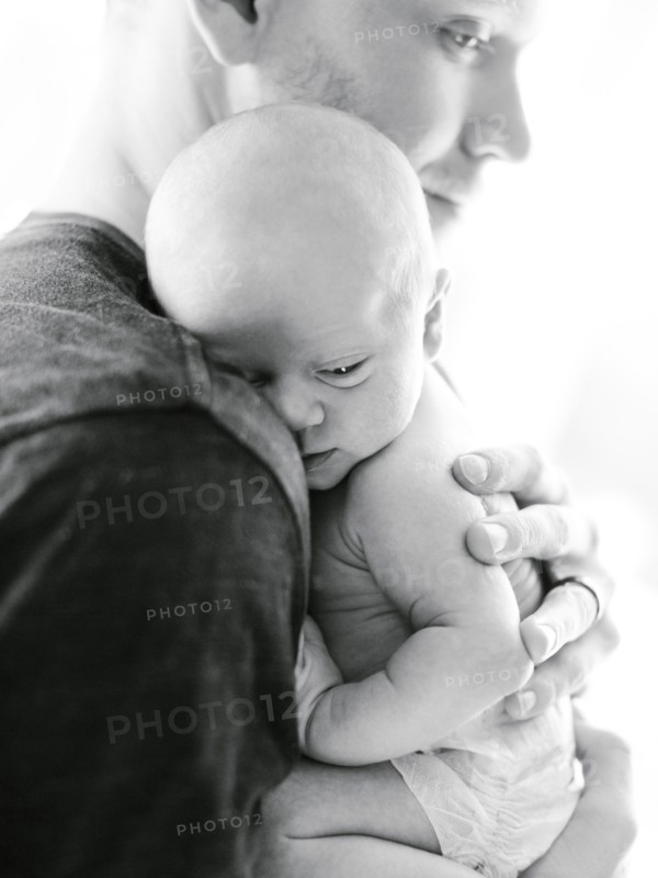 Portrait one day baby boy (0-1 months) being hold by his father