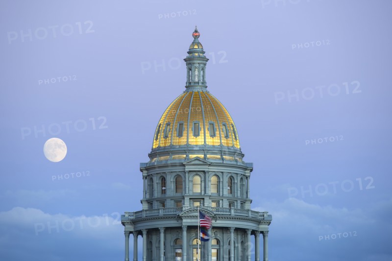 USA, Colorado, Denver, Full moon rising next to State Capitol dome