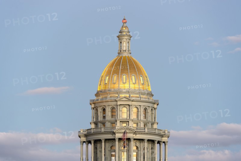 USA, Colorado, Denver, Full moon rising next to State Capitol dome