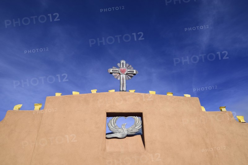 USA, New Mexico, Chimayo, Religious symbols on adobe wall