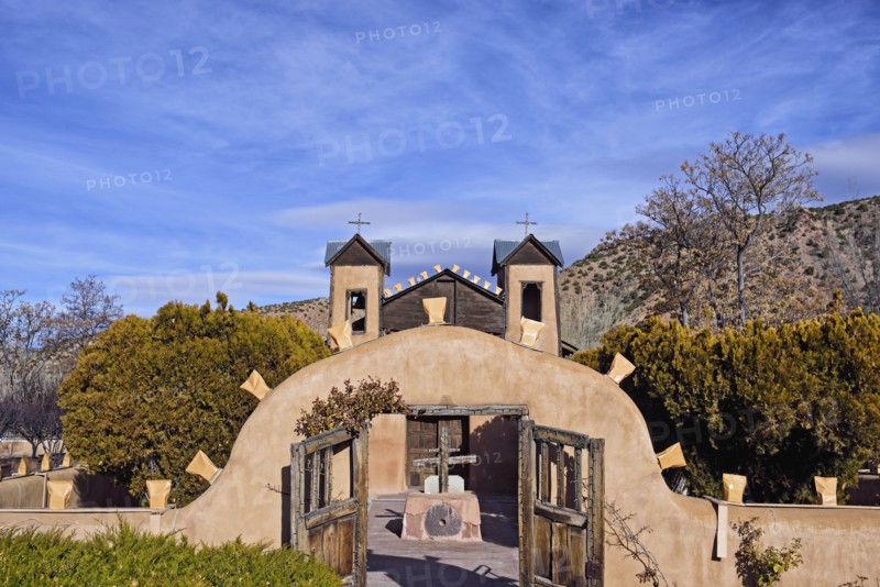 USA, New Mexico, Chimayo, El Santuario de Chimayo among trees and mountains