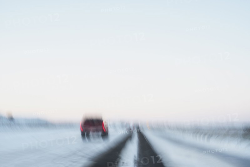 USA, New Mexico, Car on snowy highway