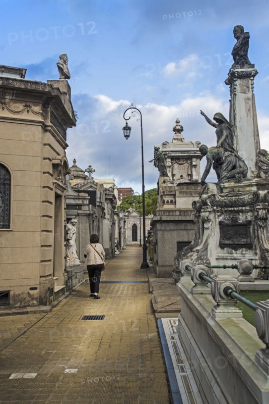 Argentina, Buenos Aires, Woman walking through Recoleta Cemetery