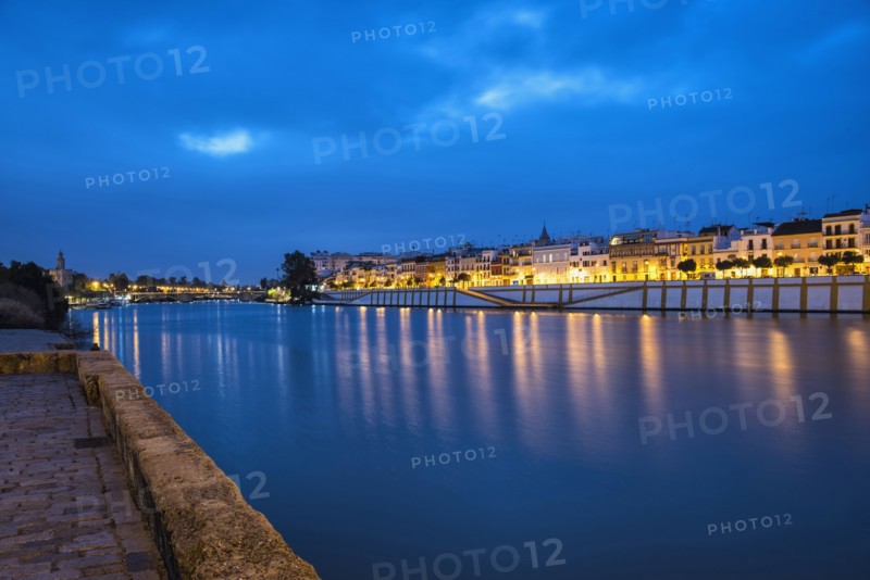 Spain, Seville, Triana, Guadalquivir river at dusk