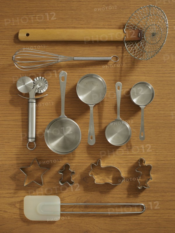 Studio shot of kitchen utensils on wooden table