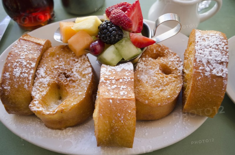 Plate with fresh french toasts and fruits