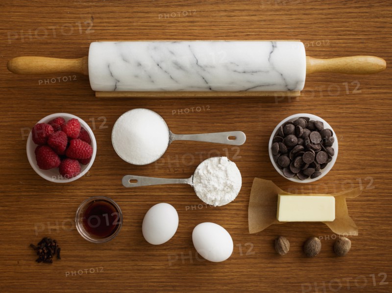 Studio shot of wooden table with rolling pin and fresh ingredients
