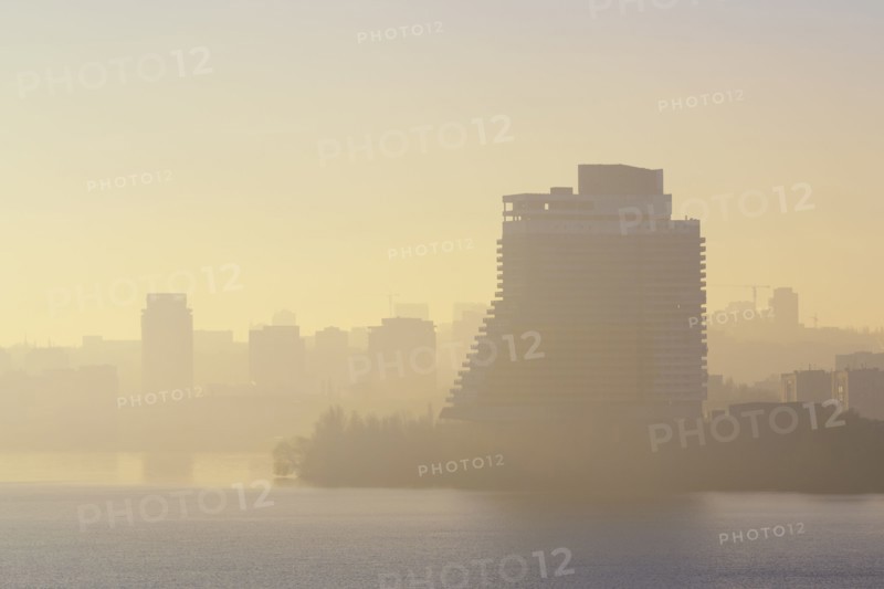Ukraine, Dnepropetrovsk, City skyline at foggy dawn