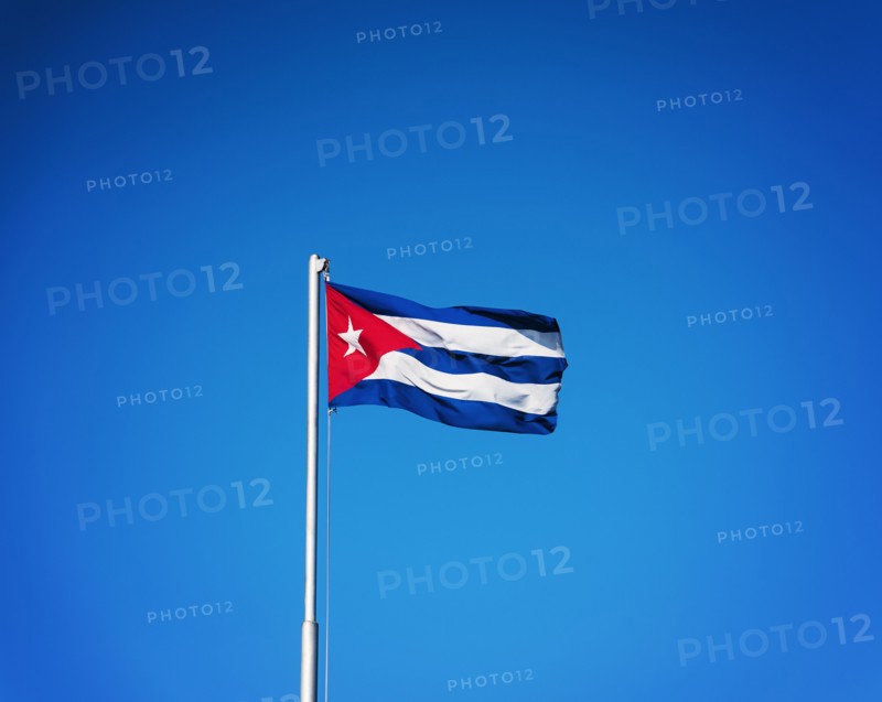 Cuba, Havana, Cuban flag with blue sky