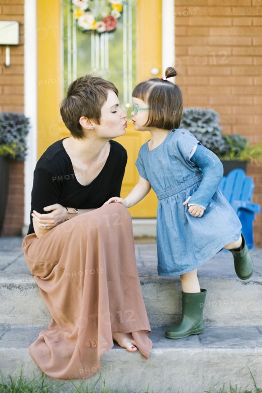 Mother kissing daughter (2-3)