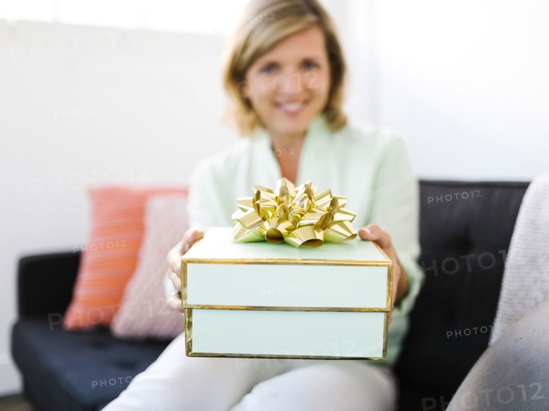 Mature woman giving gift