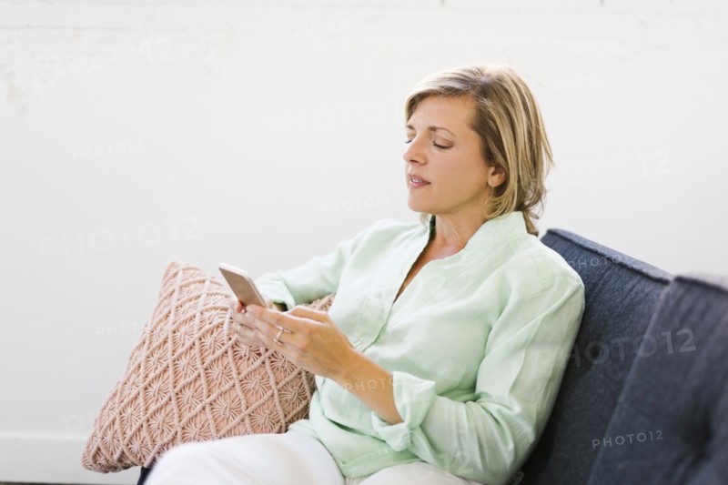 Mature woman using phone