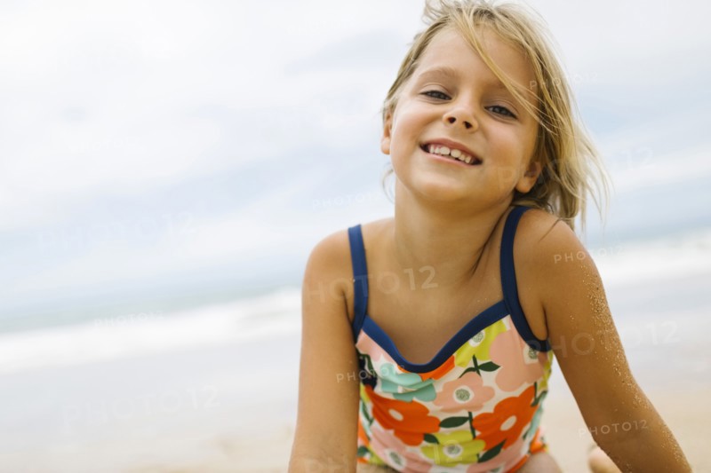 Portrait of girl (6-7) wearing swimming costume