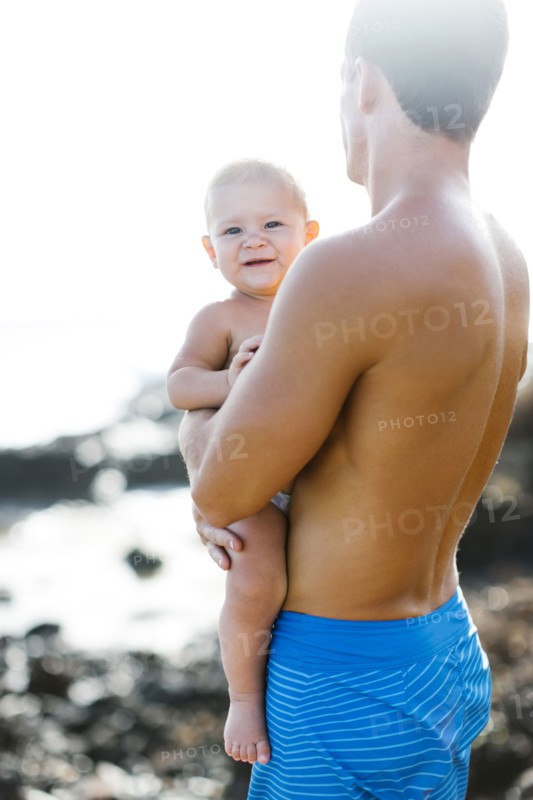 Man holding baby son (18-23 months)