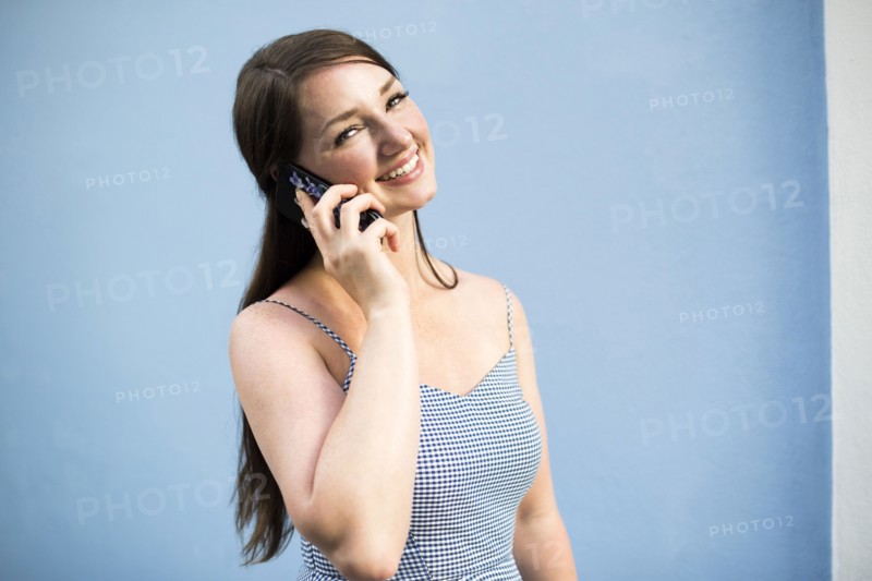 Cheerful woman during phone conversation