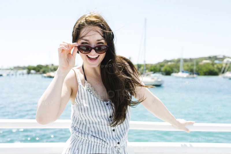 USA, Virgin Islands, Saint Thomas, Woman peeking over sunglasses
