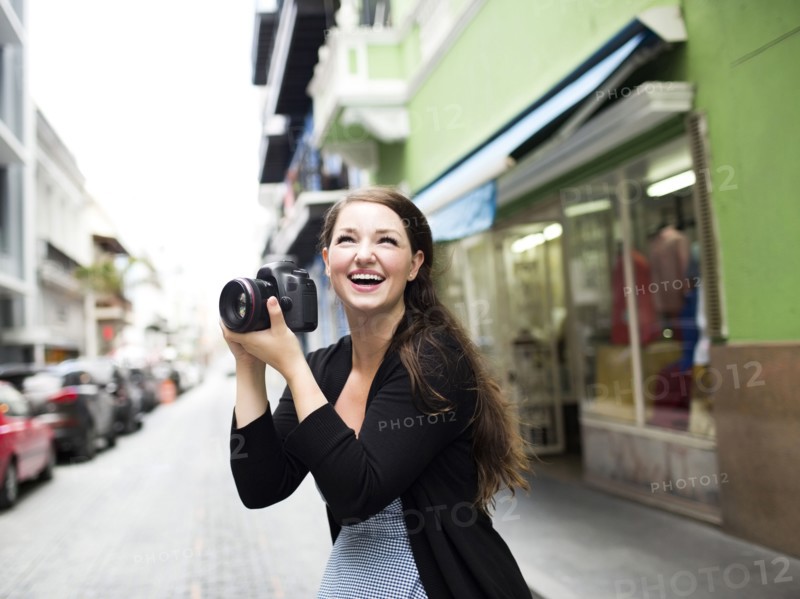 Puerto Rico, San Juan, Woman photographing on street