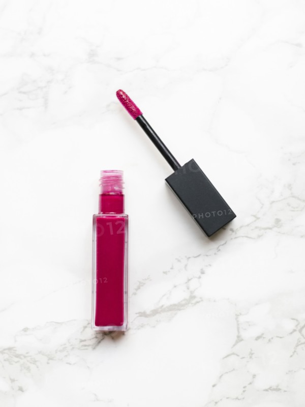 Lip gloss on marble background