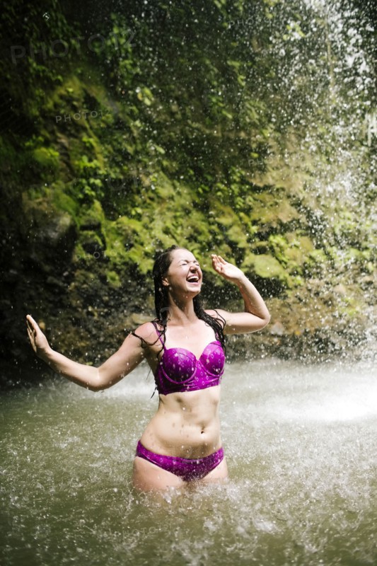 Caribbean, Saint Lucia, Woman wading in pond