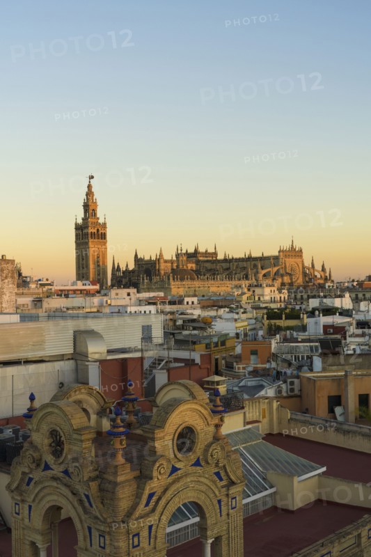 Spain, Seville, Cityscape with Cathedral of Seville at sunset