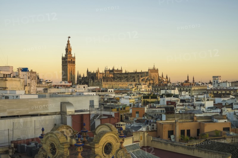 Spain, Seville, Cityscape with Cathedral of Seville at sunset