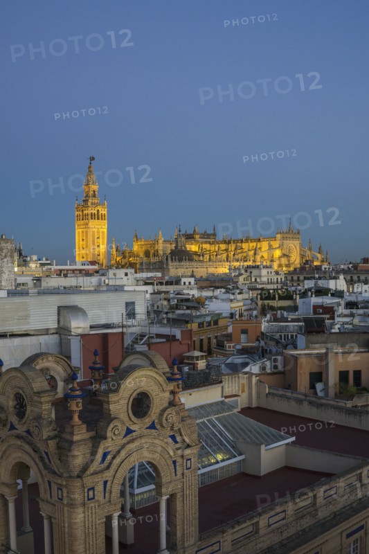 Spain, Seville, Cityscape with Cathedral of Seville at sunset
