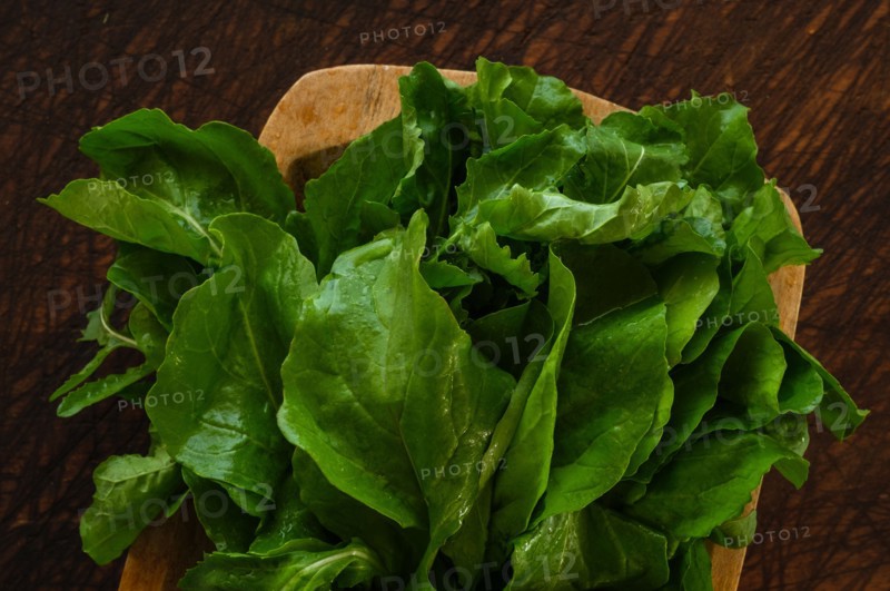 Bunch of Arugula on cutting board