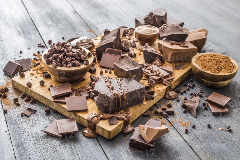 Various chocolate pieces on cutting board