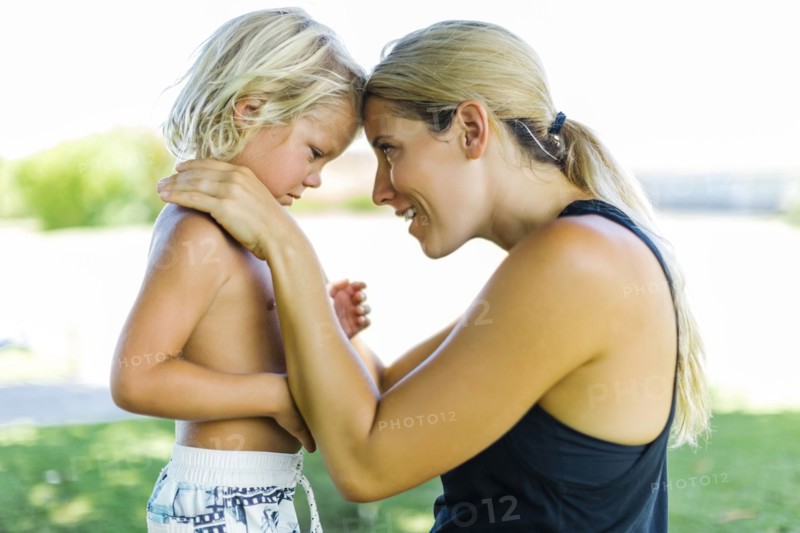 Mother with son (4-5) embracing