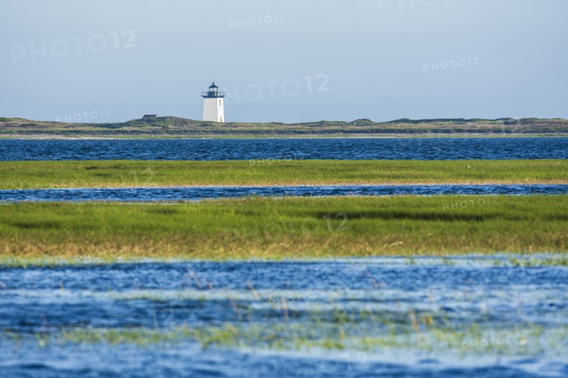 USA, Massachusetts, Cape Cod, Provincetown, Bay of water with lighthouse